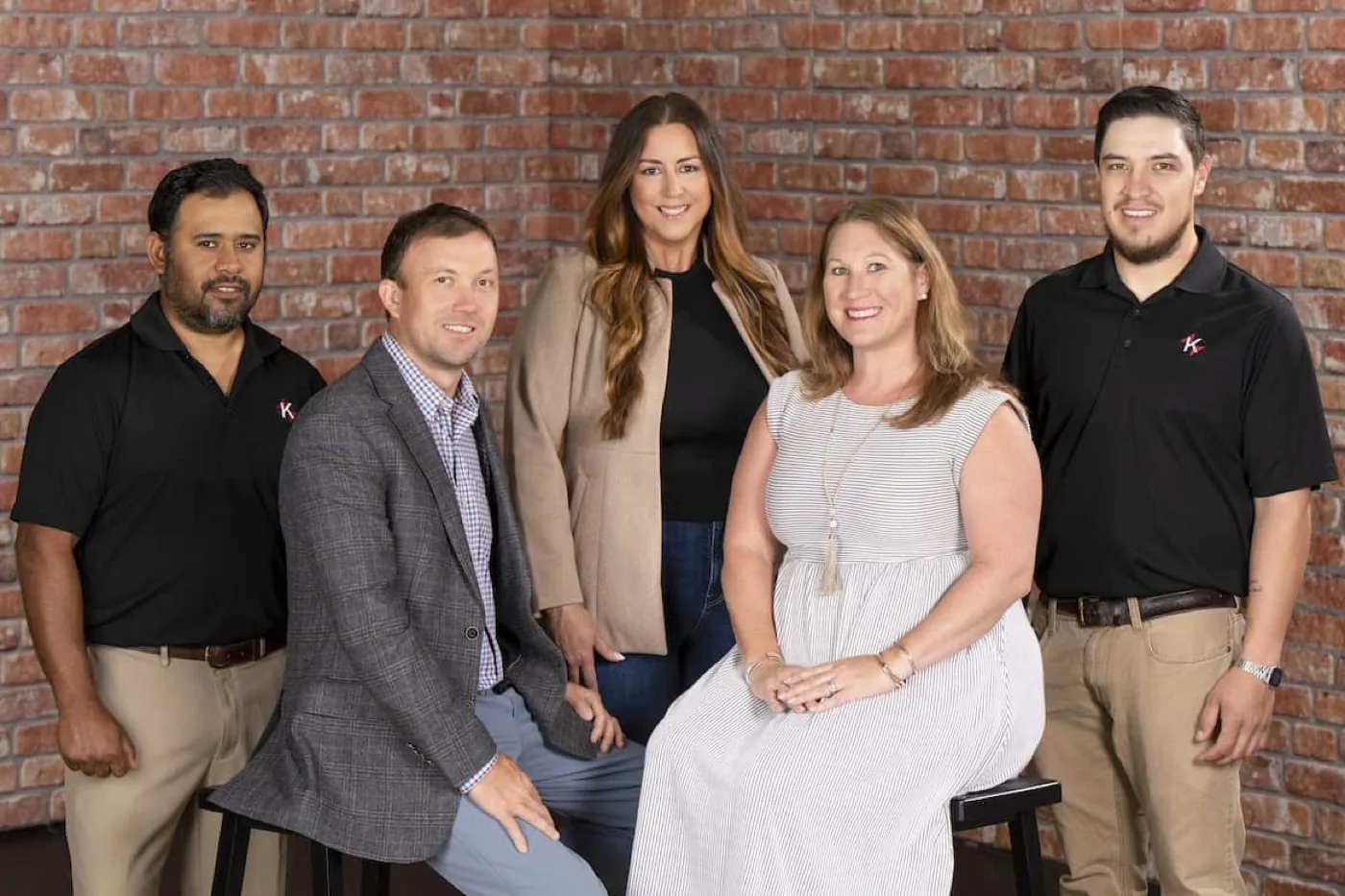 The Keitz Construction team photographed against a brick wall